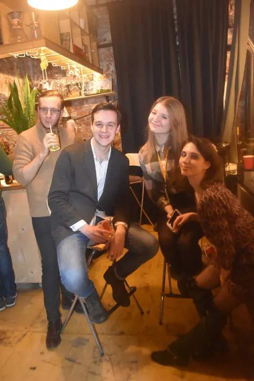 Friends sitting close together for a photograph
