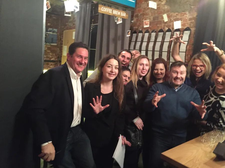 A group photograph on the opening night, everyone smiling
