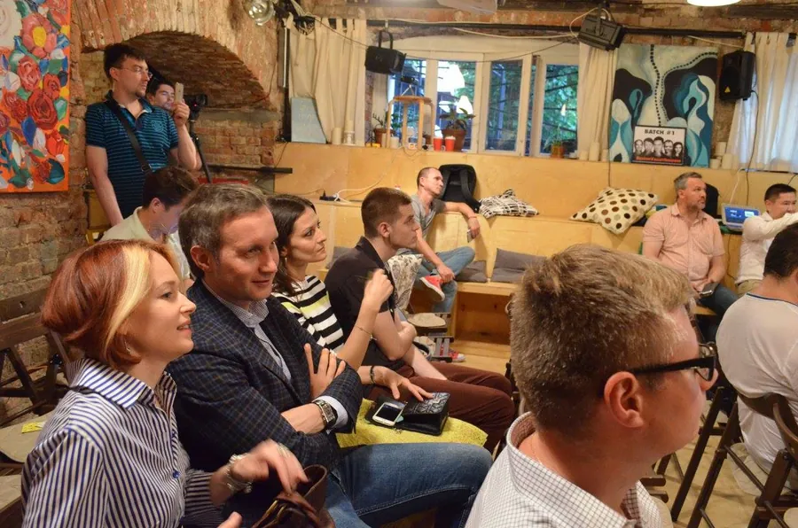A group sitting close together on the sofa, talking