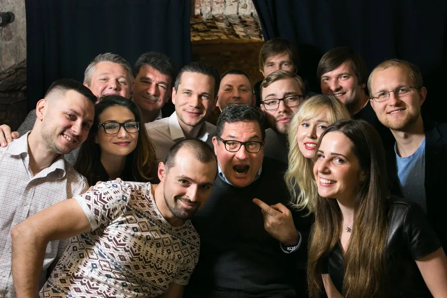 A crowd selfie, one man pulling a face in the middle