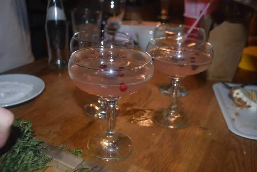 Two coupes with a cherry on the bar