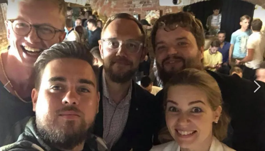 Four friends squeezed into a selfie