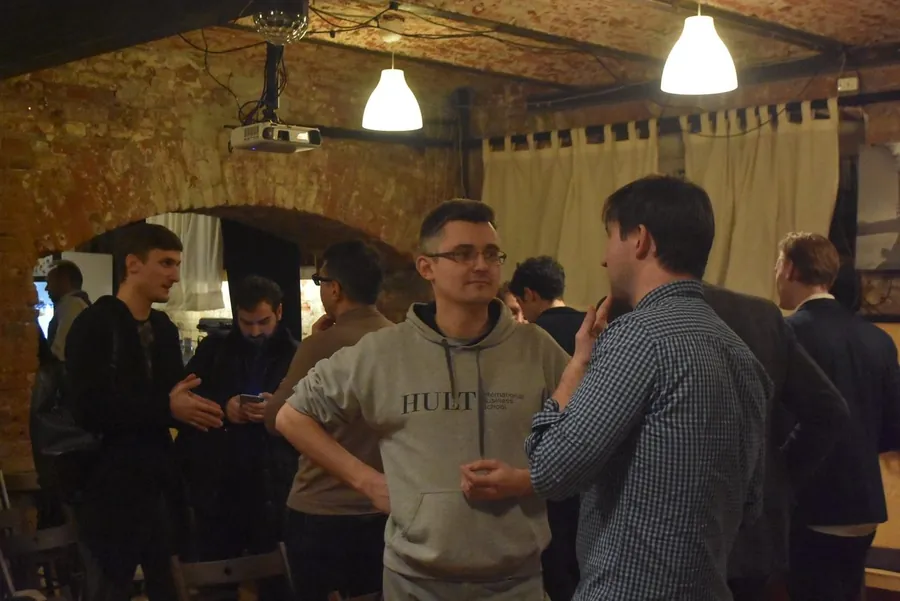 Two men in hoodies talking